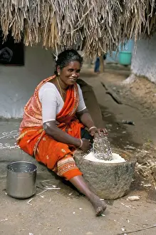 Tamil Nadu Prints: Village woman pounding rice, Tamil Nadu, India, Asia