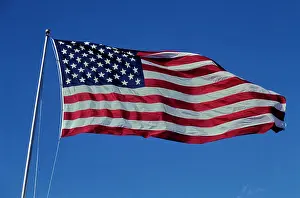 Stripes Prints: Vintage Photograph. American flag waving proudly against a clear blue sky