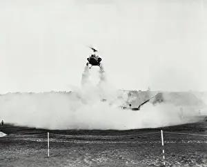 Helicopter Prints: Vintage photograph. Bell helicopter performing Black fly fogging operations