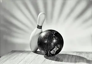 Still Life Prints: Vintage photograph. bowling ball with single pin