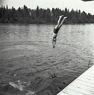 Vintage Photograph. Boy diving in water