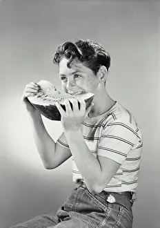 Snack Prints: Vintage photograph. Boy smiling eating watermelon