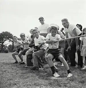 Focused Prints: Vintage Photograph. Boys in tug-of-war. Frame 1
