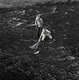 David Prints: Vintage Photograph. Two boys wearing waders fishing in river