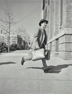 Suit Prints: Vintage photograph. Businessman in suit with briefcase walking on sidewalk. Model released