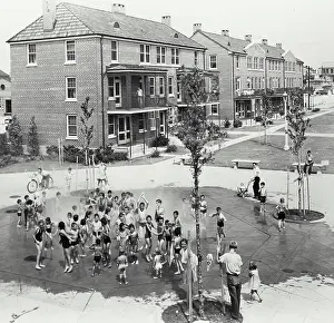 Courtyard Prints: Vintage photograph. Children playing outside in fountain at Iberville Public Housing in New Orleans