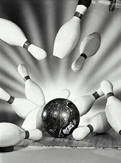 Alley Prints: Vintage photograph. Close-up of a bowling ball striking pins