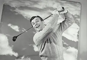 Sweater Prints: Vintage photograph. Close-up of a mid adult man swinging a golf club