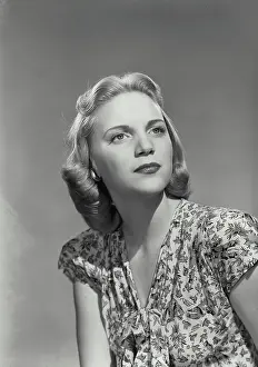 Medium Length Hair Prints: Vintage photograph. Close-up of a young woman thinking