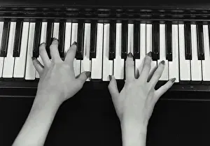 Instrument Prints: Vintage photograph. Closeup of woman's hands playing piano
