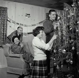 Louis Prints: Vintage Photograph. Family Decorates Christmas tree together