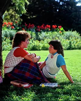 Conversation Prints: Vintage Photograph. Two friends enjoy a study session in a tranquil garden setting