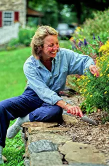 Stone Wall Prints: Vintage Photograph. Gardening happiness: enjoying nature's beauty while planting flowers