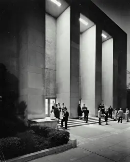 Vintage Photograph. The George Washington University night view of Lisner Auditorium. Students gather outside