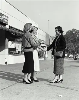 Conversation Prints: Vintage Photograph. Group of women meeting in front of store