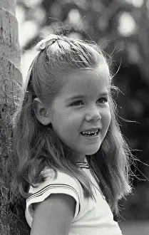 Teeth Prints: Vintage Photograph. Head of a little girl smiling