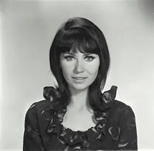 Fringe Prints: Vintage Photograph. Head and shoulder portrait of a woman with black hair and bangs