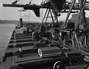 Heavy Prints: Vintage photograph. Heavy steel clamshell coal unloaders on travelling cranes unload 10