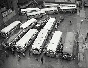 Stationary Prints: Vintage photograph. High angle view of buses parked in a bus station