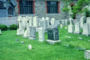 Vintage Photograph. Historical cemetery with diverse headstones and lush greenery