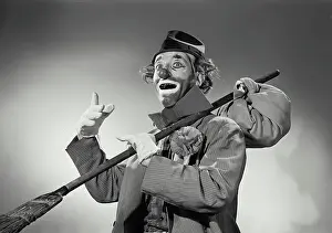 Circus Prints: Vintage Photograph. Hobo clown with sack tied to broomstick