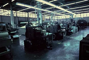 Manufacturing Prints: Vintage Photograph. Industrial printing machines in action at a busy factory floor