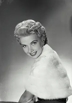Vintage Photograph. June Kirby. Model Released. Portrait of woman in fur jacket smiling. Frame 1