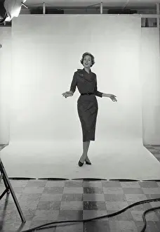 Photoshoot Prints: Vintage Photograph. Full length view of Businesswoman on white studio background