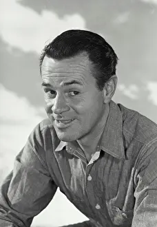 Sharp Prints: Vintage photograph. Man in button shirt smiling at camera
