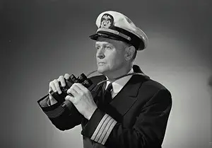 Neck Prints: Vintage Photograph. Man in captains uniform holding binoculars around neck