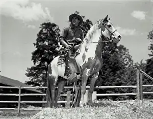 Wild West Prints: Vintage Photograph. Man riding horse inside pen. Frame 2