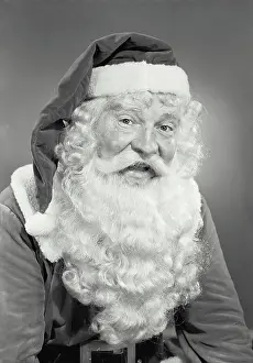 Santa Prints: Vintage photograph. Man in Santa Claus costume smiling