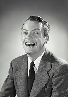 Business Suit Prints: Vintage photograph. Man in suit and tie with huge smile