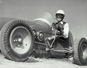 Race Prints: Vintage photograph. Man wearing race goggles driving Allen Offy - Special midget auto racer