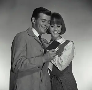 Vest Prints: Vintage Photograph. A man and woman looking at bank book excitedly