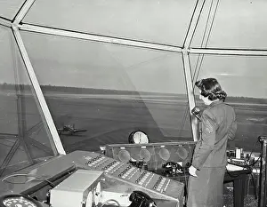 Marine Prints: Vintage photograph. Marine staff Sergeant clearing a plane to the line where the ship will be parked in a special area