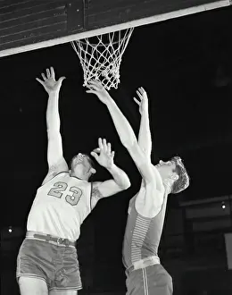 Joseph Prints: Vintage Photograph. Two men playing basketball jumping up for ball near basket