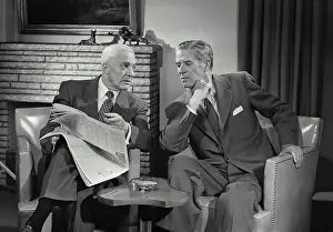 Talk Prints: Vintage Photograph. Men in suits sitting in chairs talking with each other in living room