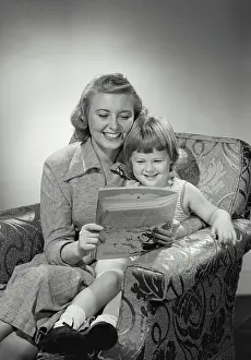 Quality Time Prints: Vintage photograph. Mother and daughter smiling and reading together