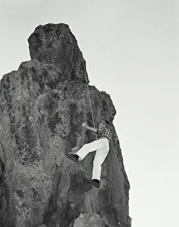 Geological Prints: Vintage photograph. Mountain climber climbing rock formation