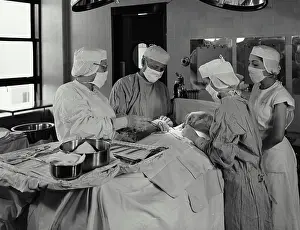 Doctors Prints: Vintage Photograph. Operation in progress at Charity Hospital in New Orleans LA