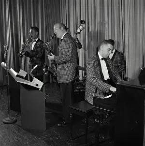 Bill Prints: Vintage Photograph. Five piece orchestra preforms their music on stage