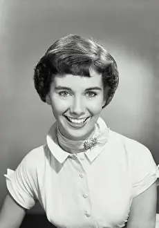 Ribbon Prints: Vintage photograph. Portrait of brunette woman smiling wearing ribbon neck scarf