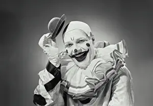 James Prints: Vintage photograph. Portrait of clown putting on silly hat