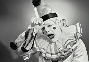 Circus Prints: Vintage photograph. Portrait of clown in silly hat with shocked expression