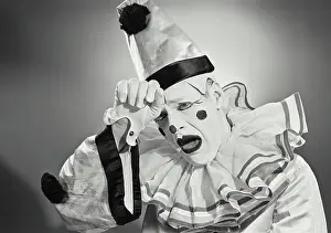James Prints: Vintage photograph. Portrait of clown in silly hat with shocked expression