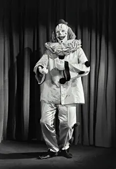 James Prints: Vintage photograph. Portrait of clown wearing silly hat and dancing