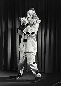 Face Paint Prints: Vintage photograph. Portrait of clown wearing silly hat and playing toy horn