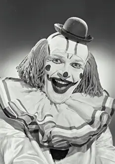 James Prints: Vintage photograph. Portrait of clown wearing silly hat and smiling wide