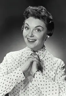 Vintage Photograph. Portrait of woman in button blouse smiling. Frame 3